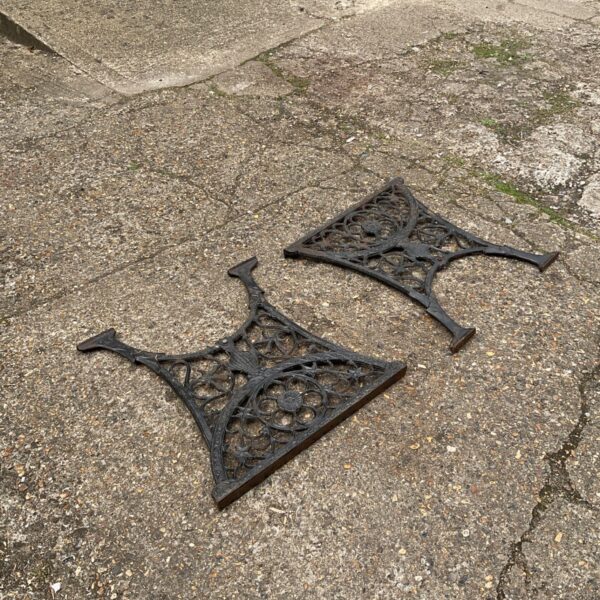Set of four antique cast iron table legs with Victorian detailing.