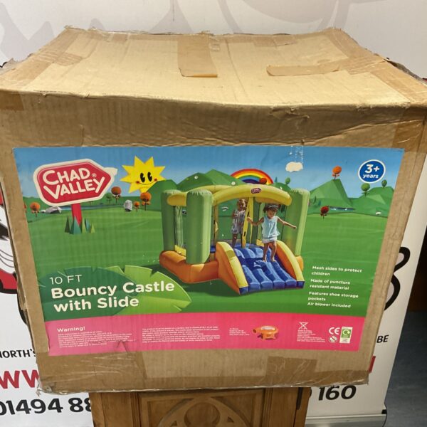 Chad Valley 10ft bouncy castle with slide for kids garden play.