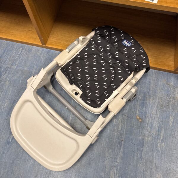 Black and grey Chicco folding high chair for babies.