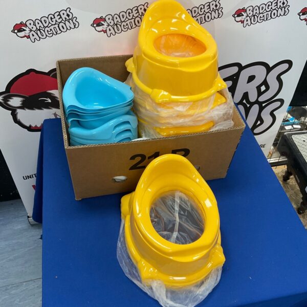 New brightly coloured children's potties stacked and ready for use.
