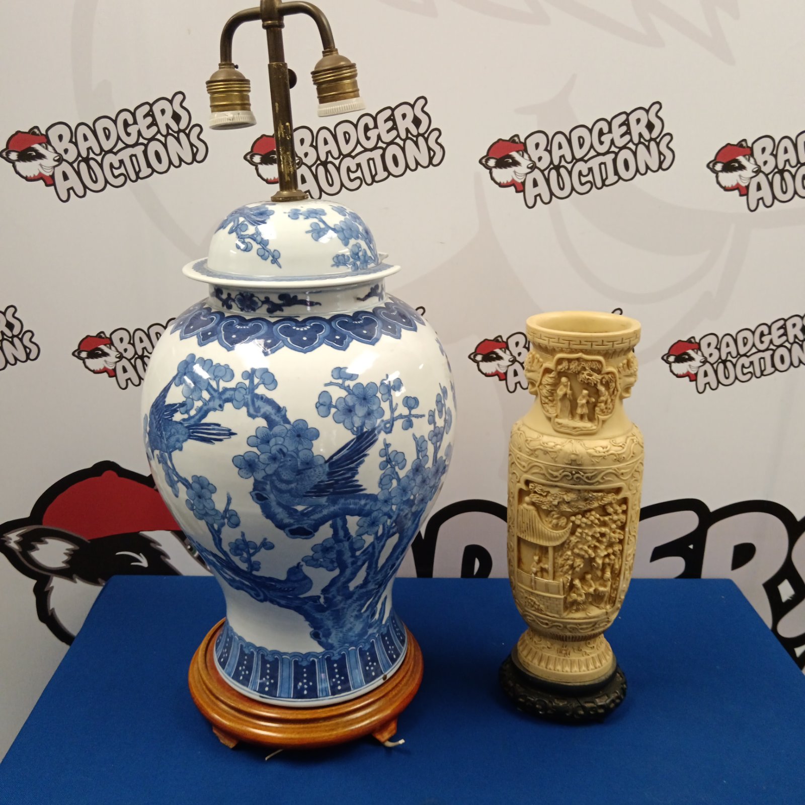 Large Chinese blue and white porcelain table lamp with wood base.
