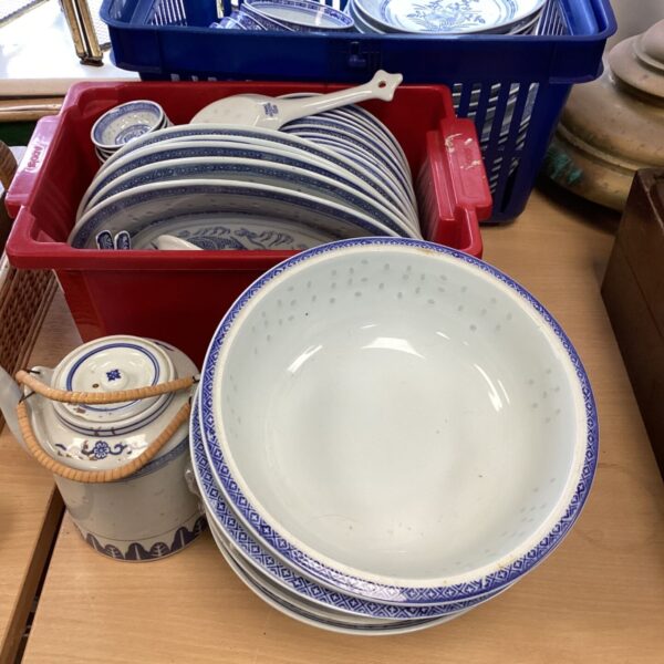 Large Chinese dinner service with blue and white porcelain plates and bowls.