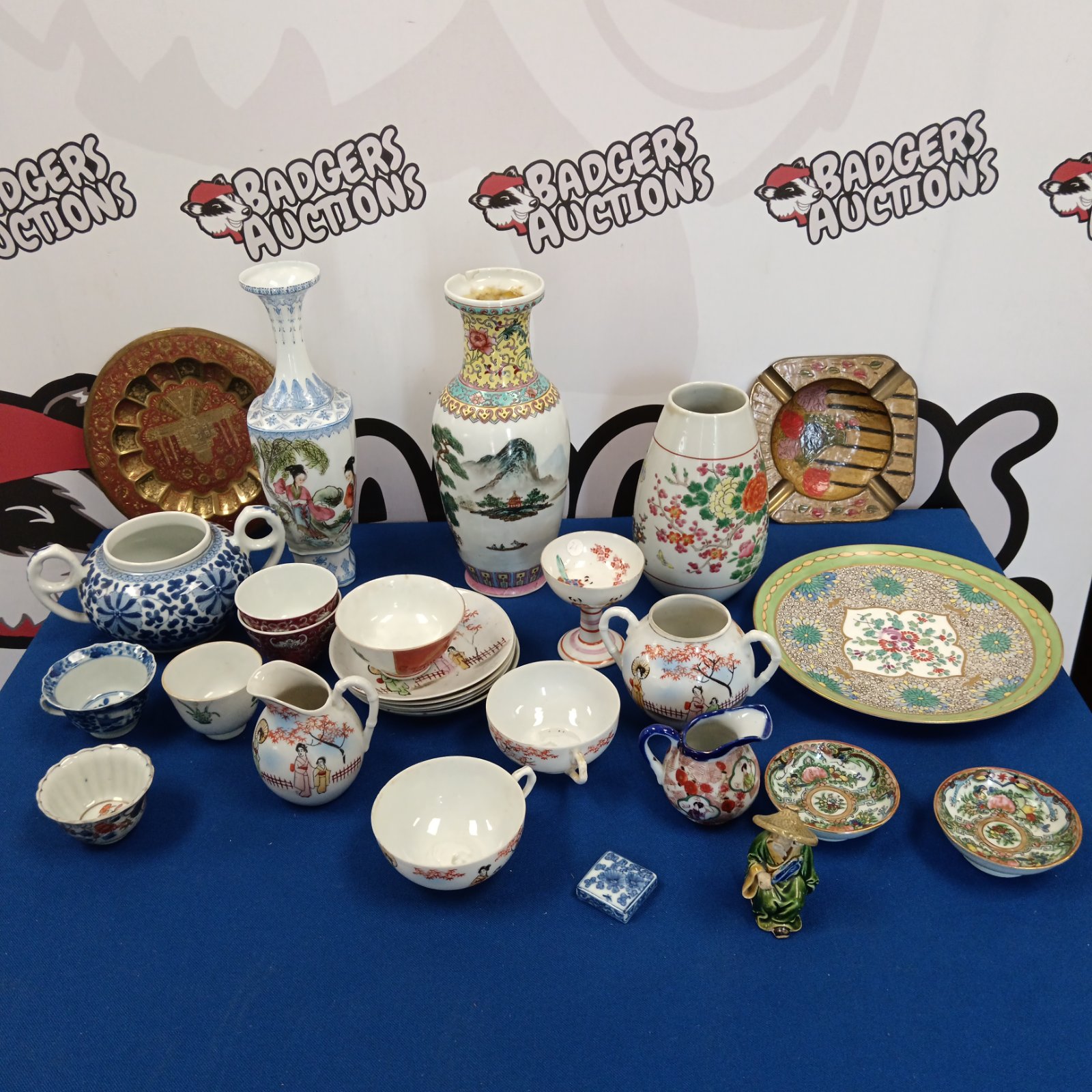 Assorted Chinese porcelain vases, plates, and cups in a collection.