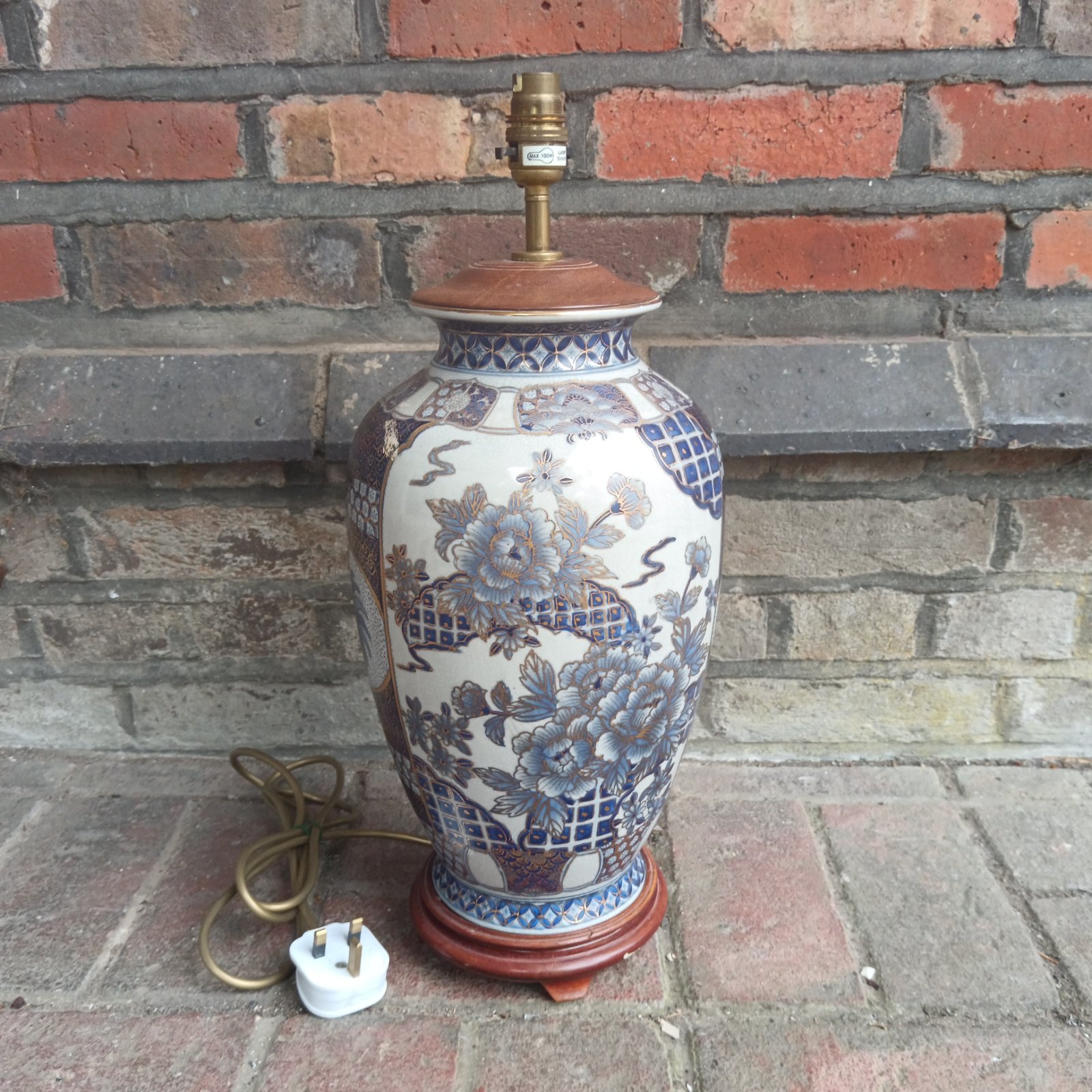 Vintage blue and white Chinese porcelain table lamp with floral design.