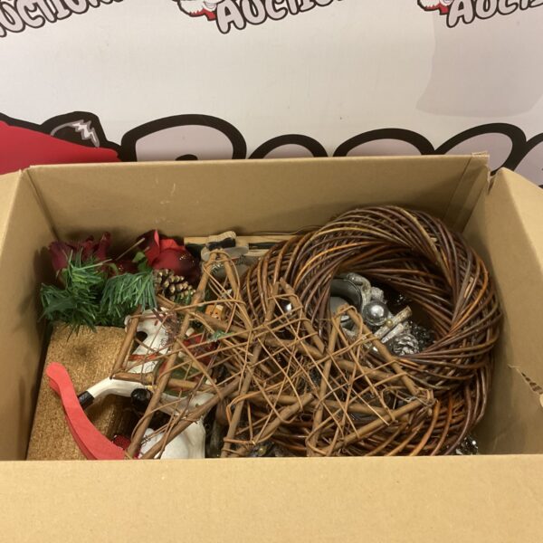Box of mixed vintage Christmas decorations and festive ornaments.