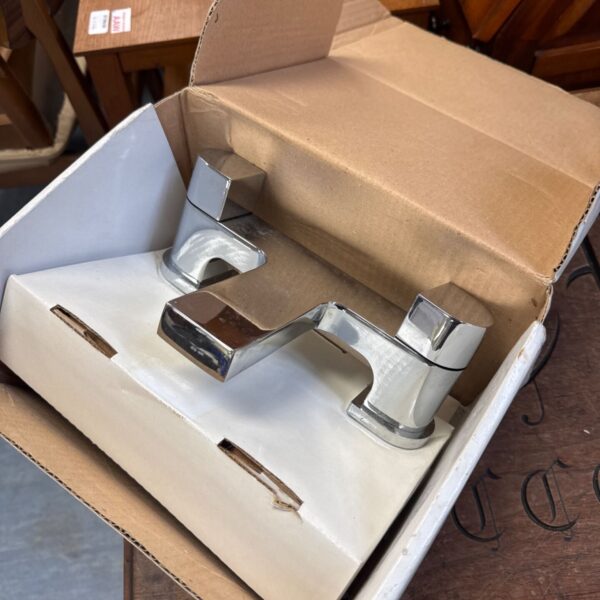 Chrome bath mixer tap by PJH group, a classic bathroom fitting.
