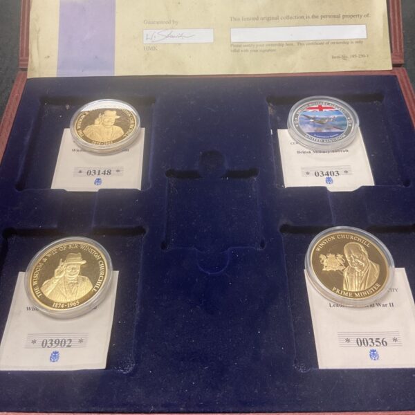 Set of Churchill commemorative coins and Spitfire coin.