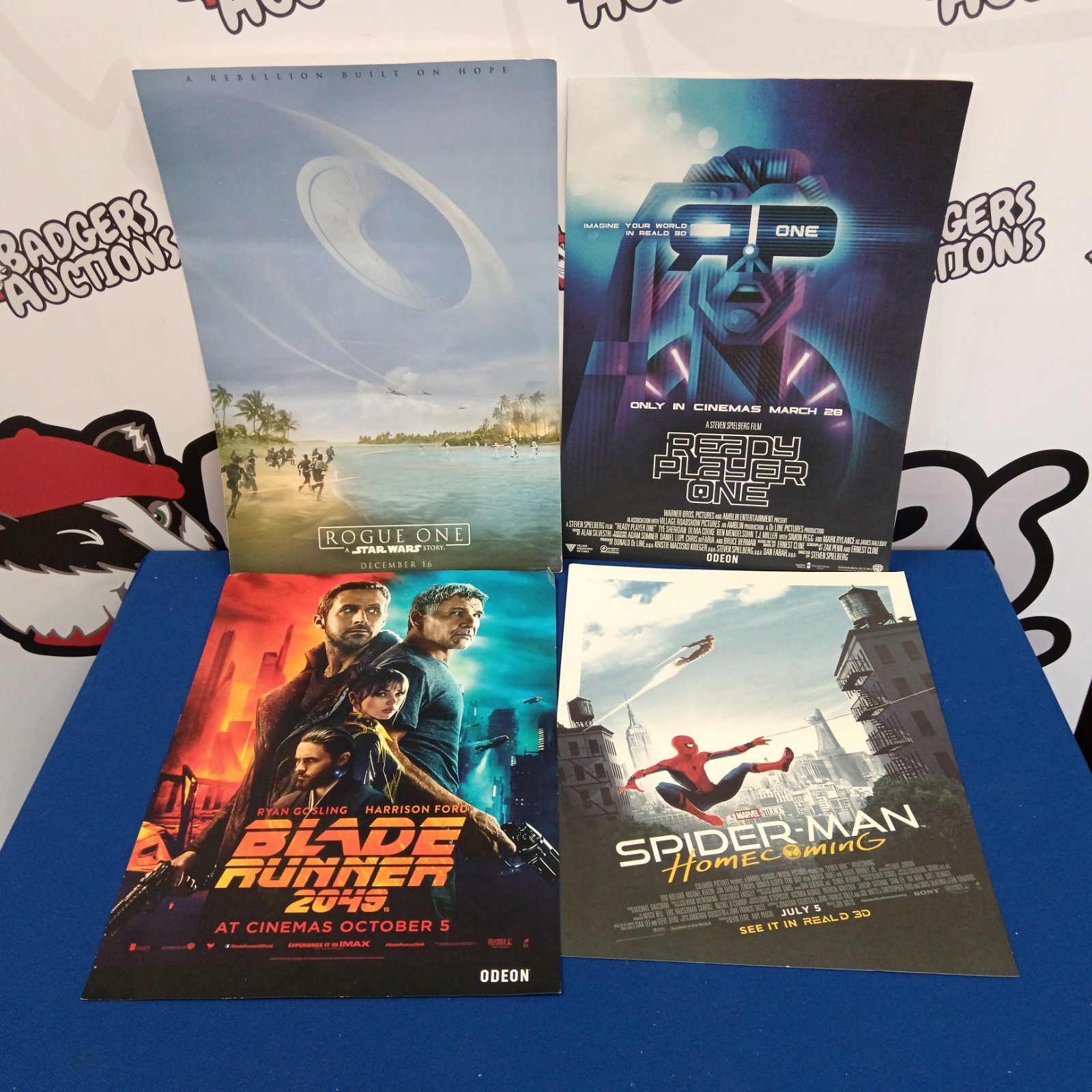 Vintage cinema lobby cards featuring Star Wars and Spiderman.