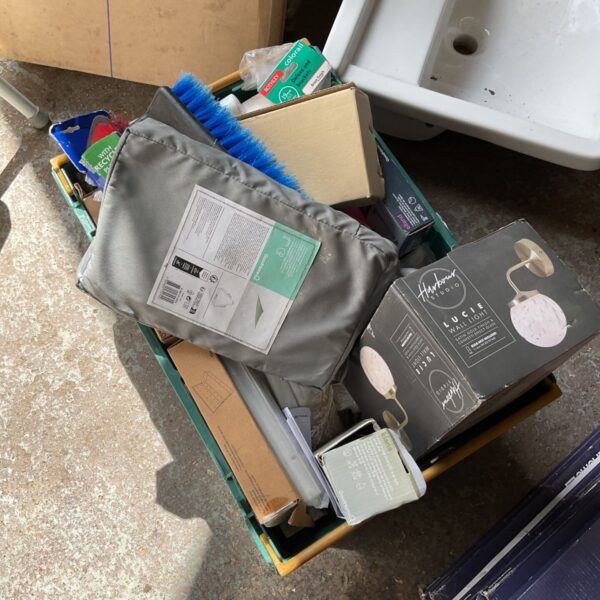 Mixed clearance lot of household items and cleaning supplies.