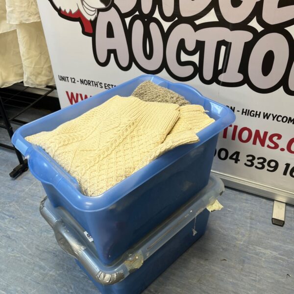Two boxes filled with a clothes lot for auction.