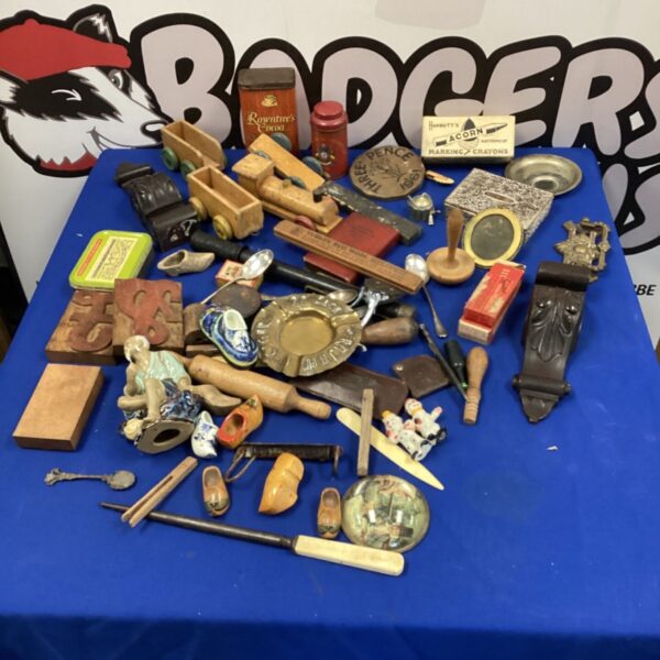 Vintage collectors box filled with antique items and ephemera.