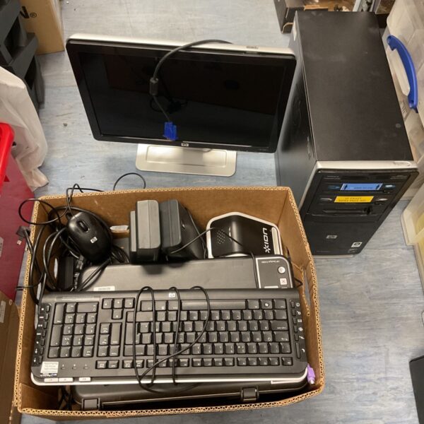 Computer monitor and accessories lot including keyboard and mouse.