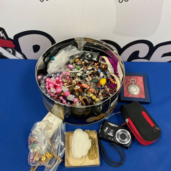 Large tub filled with a colourful assortment of costume jewellery.