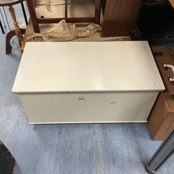 Cream wooden toy box, vintage children's storage solution.