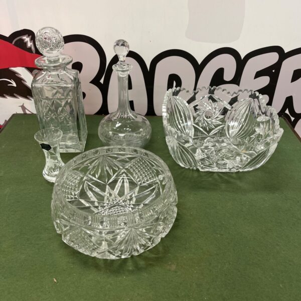 Clear crystal glassware set with geometric star pattern.