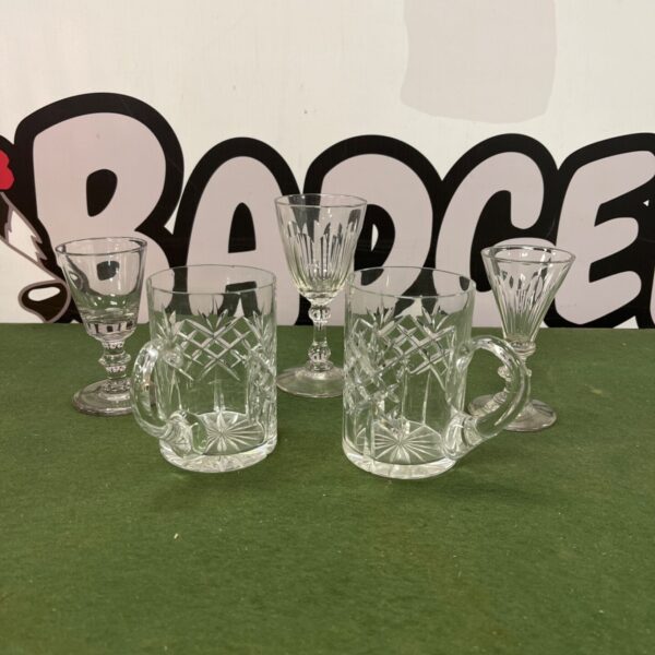 Vintage crystal goblets and tankards with cut glass detailing.
