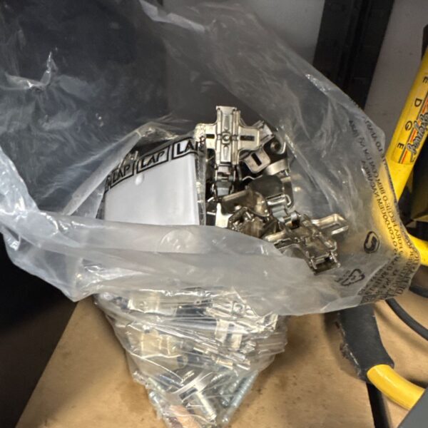 Quantity of cupboard door hinges with blanking plates.