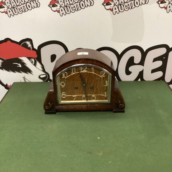 Vintage C.w.s ltd oak mantle clock with Roman numeral dial.