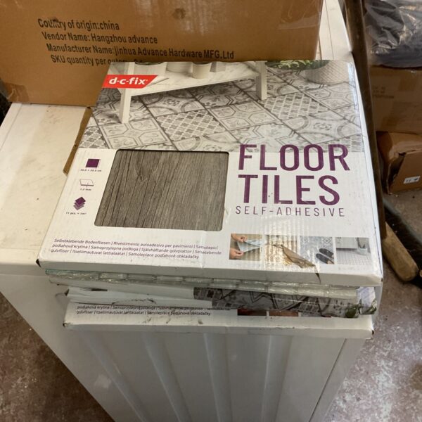 Pack of d-fix self adhesive floor tiles for home improvement projects.