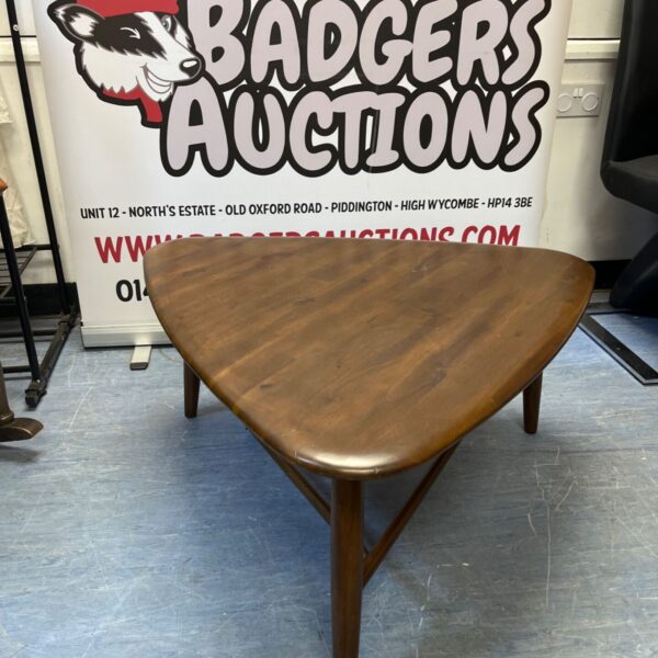 Vintage Danish Modern walnut coffee table with tripod legs.