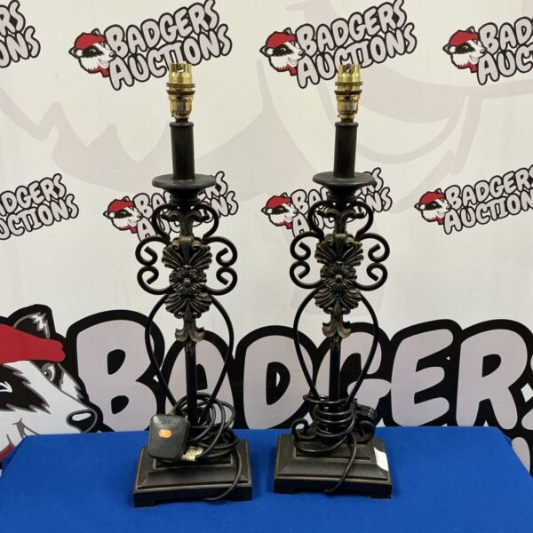 Pair of vintage wrought iron table lamps with floral details.