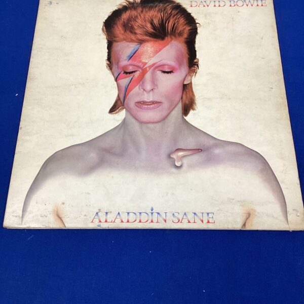 David Bowie *Aladdin Sane* album cover with signature.