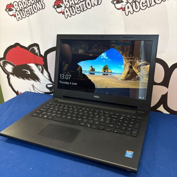 Used Dell Inspiron 15 laptop, showing the screen and keyboard.