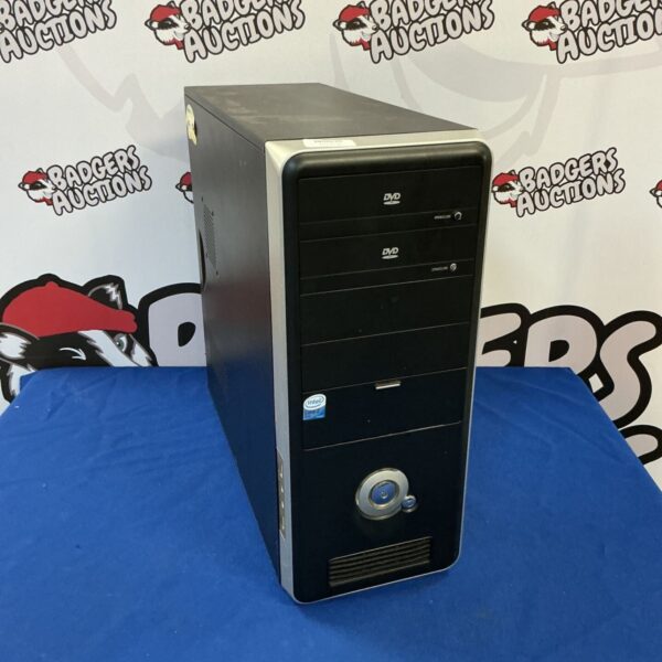 Vintage desktop computer with Windows XP installed, front view.