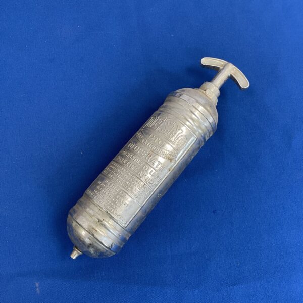 Vintage Desmo car fire extinguisher, classic automotive safety equipment.