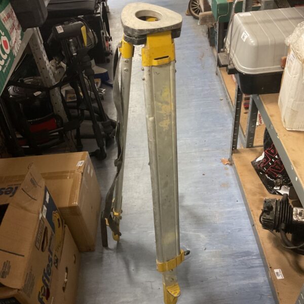 DeWalt construction tripod with telescopic legs for leveling tools.