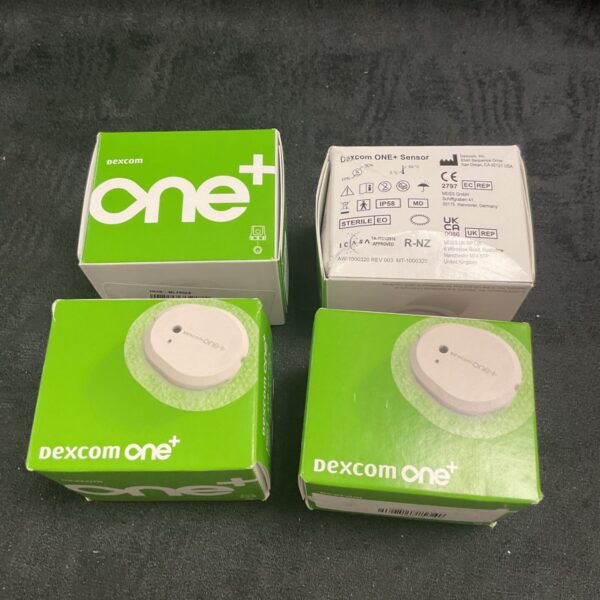 Dexcom One+ glucose monitor sensor packaging and device.