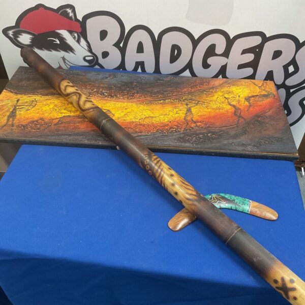 Traditional didgeridoo with Aboriginal cave painting artwork.