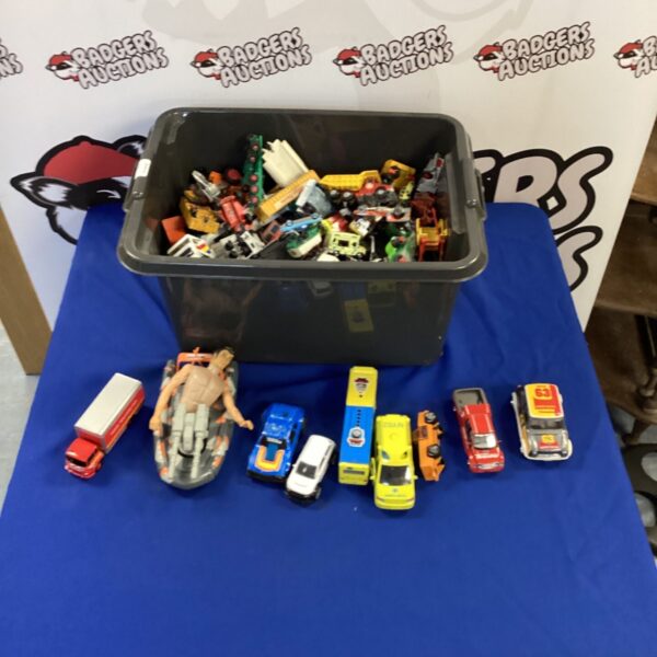 Mixed lot of diecast vehicles, including toy cars and trucks.