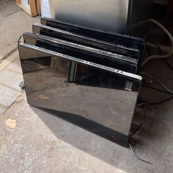 Black digital electric heater with a digital display.