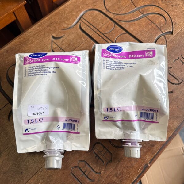 Two unopened 1.5L pouches of Diversey Suma D10 Conc detergent.