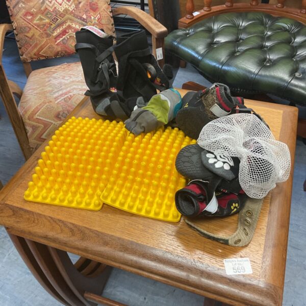 A collection of used dog boots for canine paw protection.