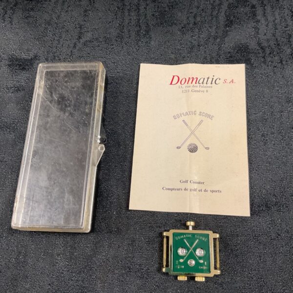 Vintage Domatic golf counter watch with original clear plastic case.