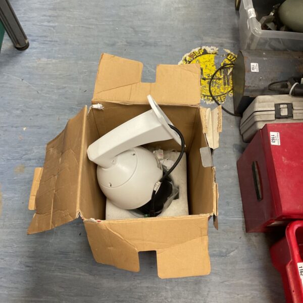 Dome camera for CCTV security surveillance, showing signs of wear.