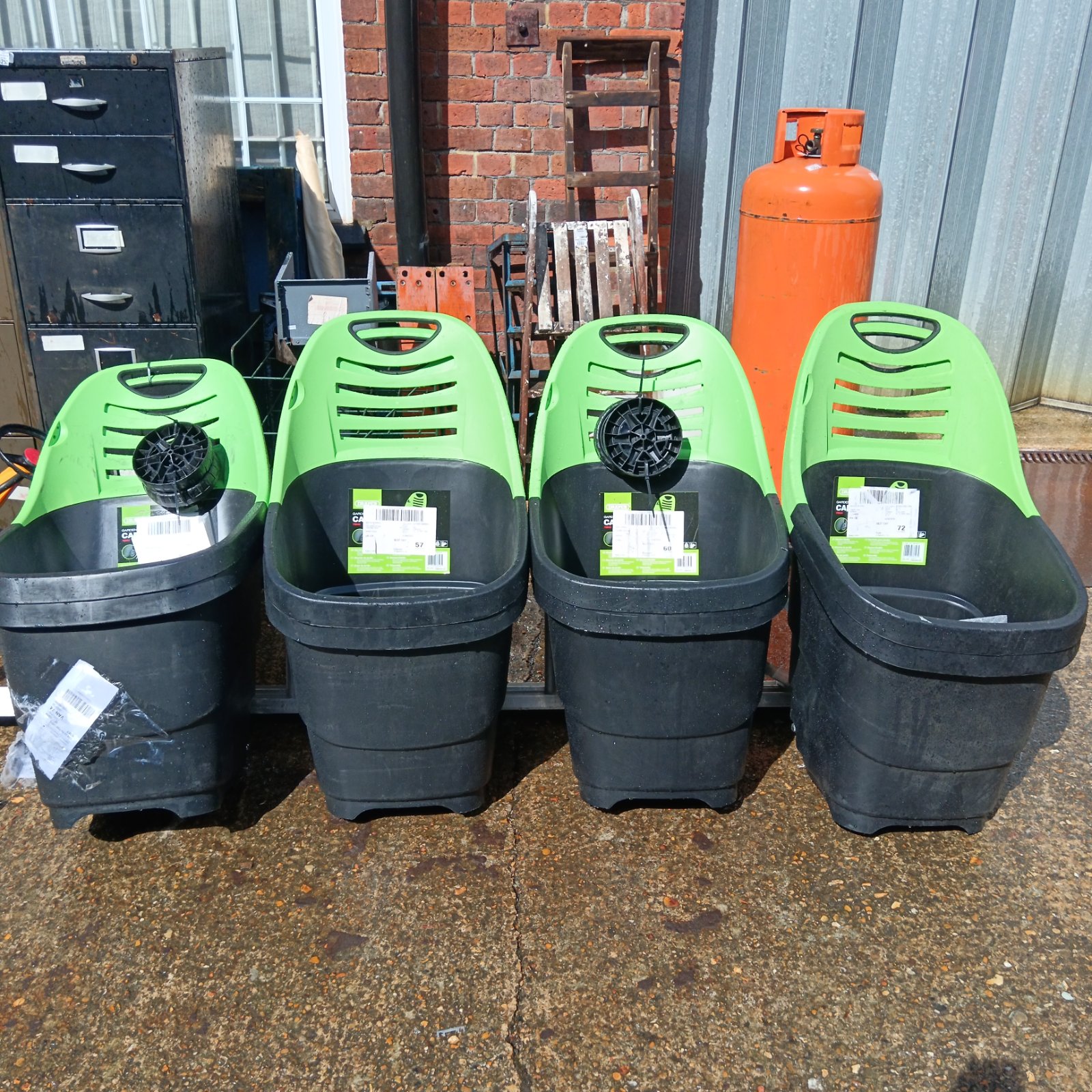 Lot of Draper garden caddies for collecting garden waste.