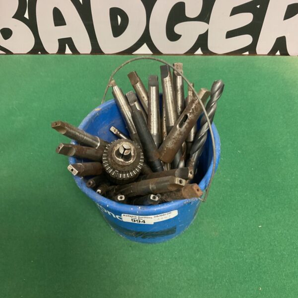 Bucket of assorted drill bits for metal and wood.