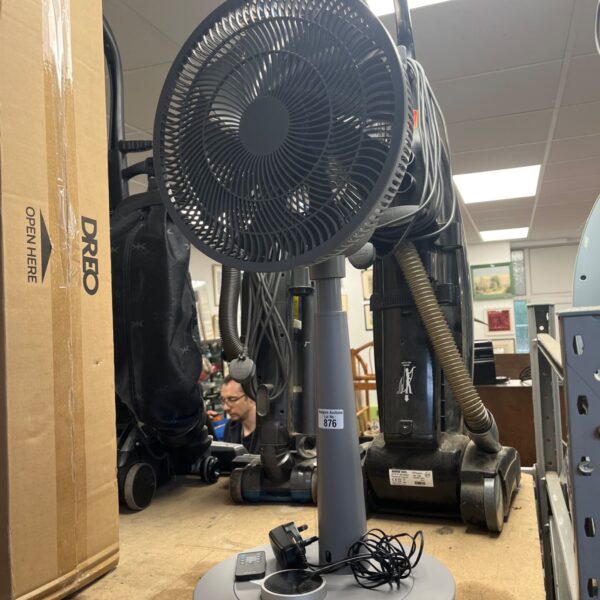 Grey Duux Whisper 3 fan with magnetic remote control on base.