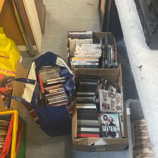 Mixed lot of DVDs and CDs including Shadows DVD for home entertainment.