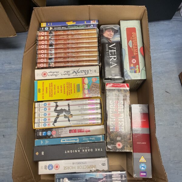 Box of DVD collections including Vera, Lee Evans and The Dark Knight.