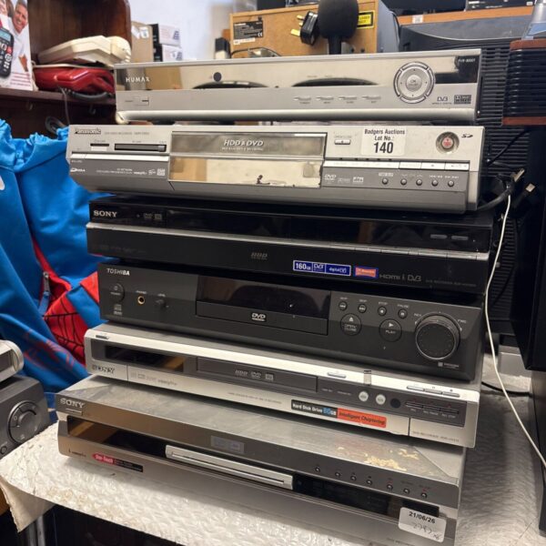 Stack of vintage DVD players and Humax PVR for collectors.