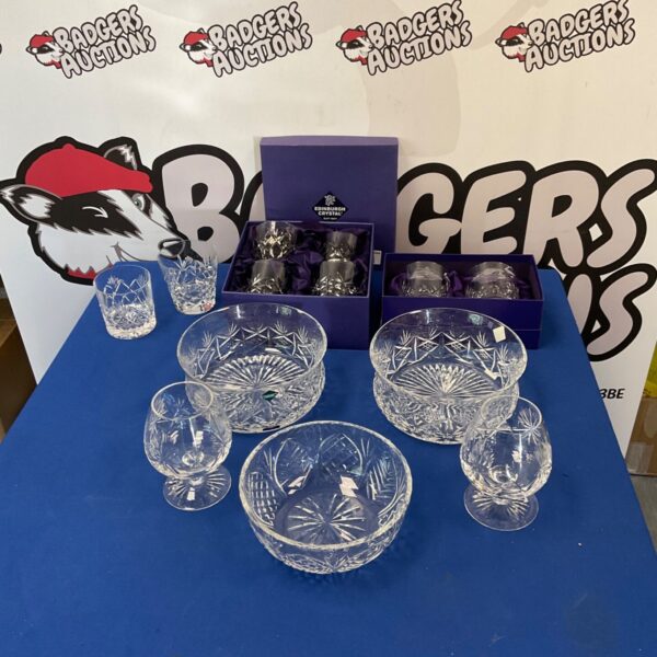 Edinburgh Crystal bowls and glasses set displayed for auction.