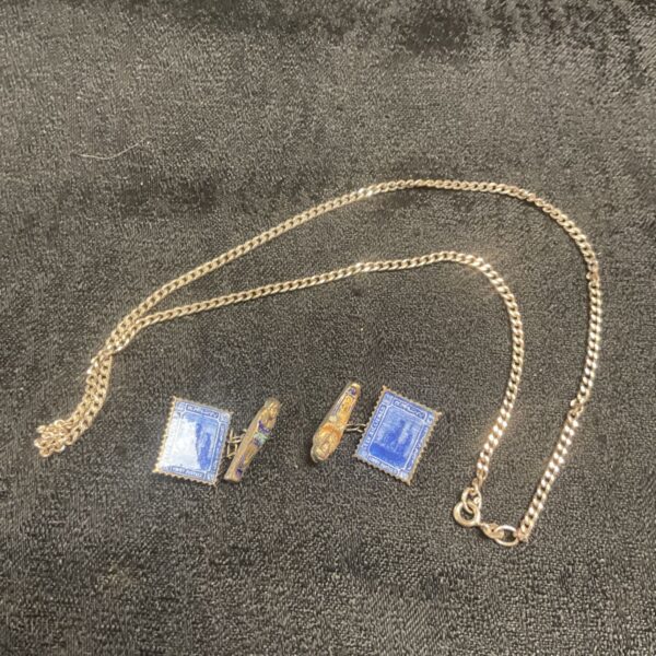Vintage silver Egyptian cufflinks and necklace set, detailed pharaonic design.