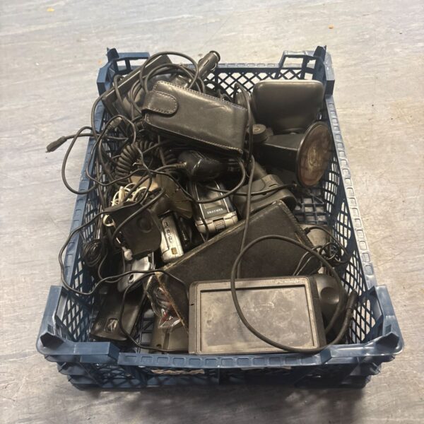 Crate filled with mixed lot of electricals including sat navs and phones.