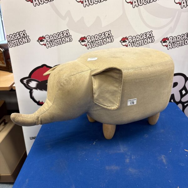 Vintage upholstered elephant footstool, a quirky home decor item.