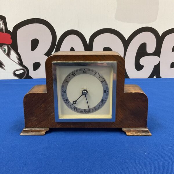Vintage Elliott of London mantle clock with oak case.