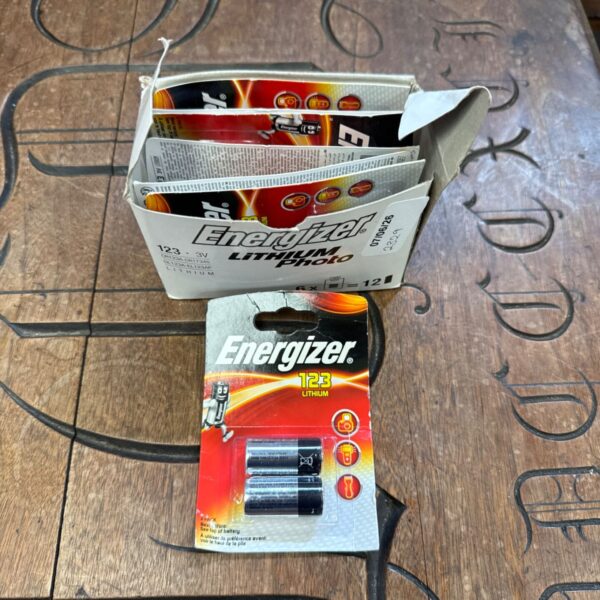 Stack of unopened Energizer 123 lithium battery packages.